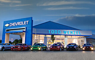 a car store with cars parked outside- how painting enhances your commercial space